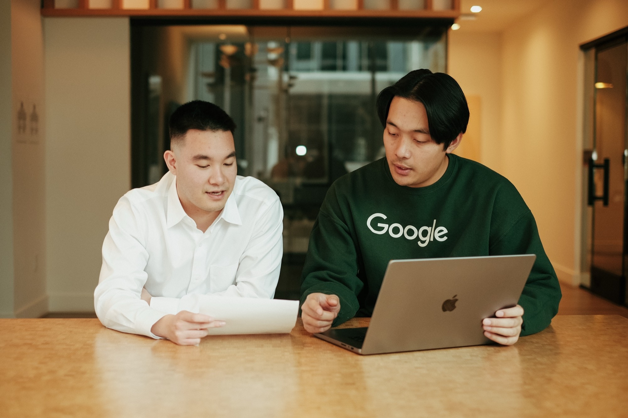 Alex coaching a client at a table